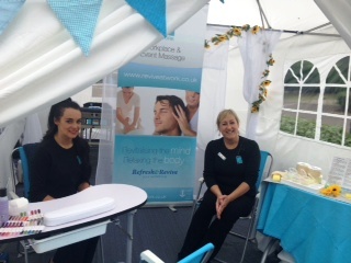 Revive-at-Work therapists offer Indian Head Massages (seated massage without oils) and Hand/Foot Reflexology for colleagues at an event at Lloyds Tredegar Park.